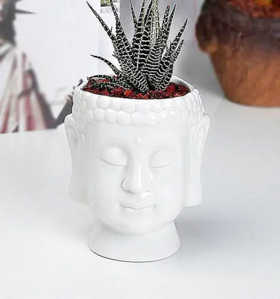 Pot-de-Fleur-Blanc-avec-Tête-de-Bouddha